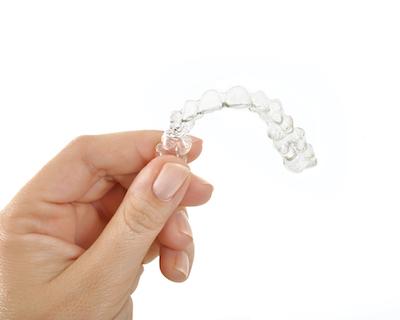 person holding their clear aligners in hampton park 