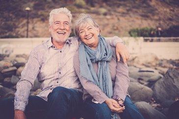 smiling couple with dental implants in hampton park