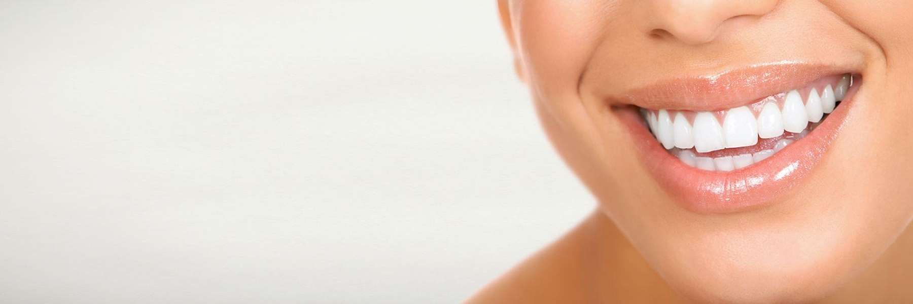 woman smiling after teeth whitening services in hampton park